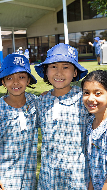 Sacred Heart Mt Druitt students playing on sports field