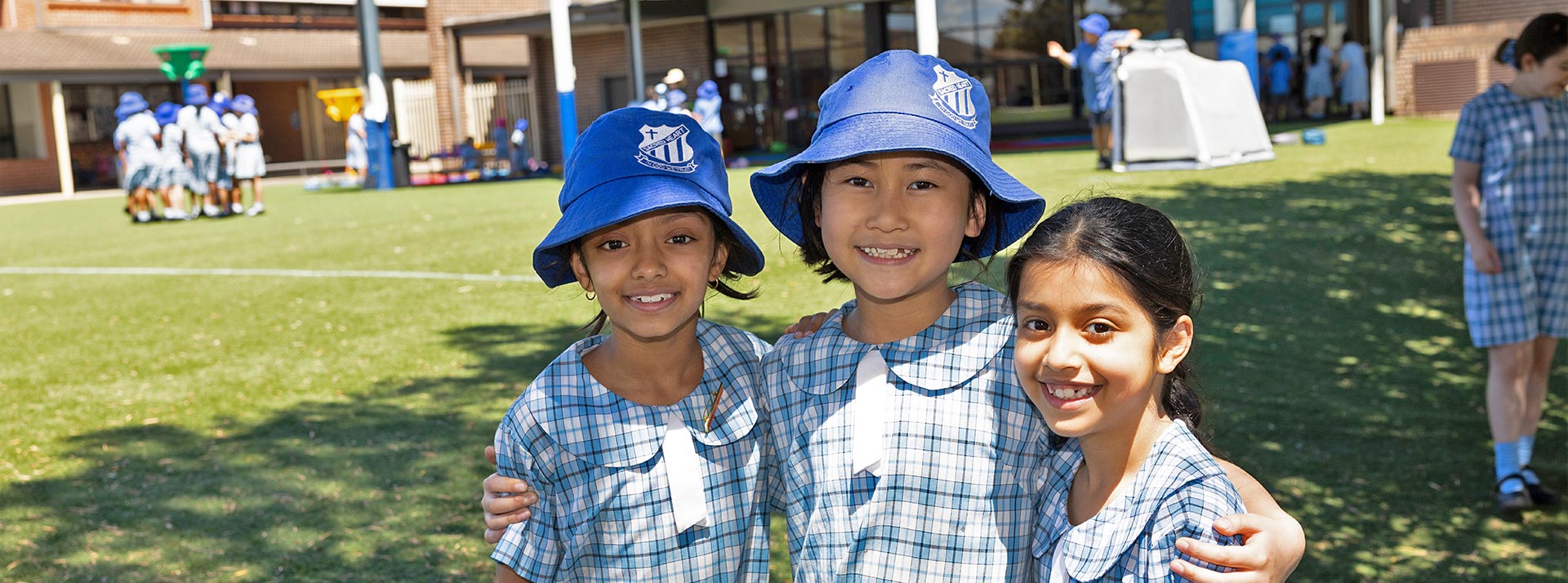 Sacred Heart Mt Druitt students playing on sports field