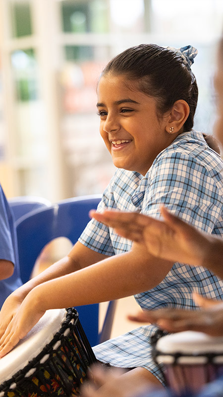 Sacred Heart Primary student playing drums