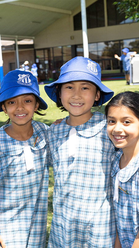 Sacred Heart Mt Druitt students outdoors on school field