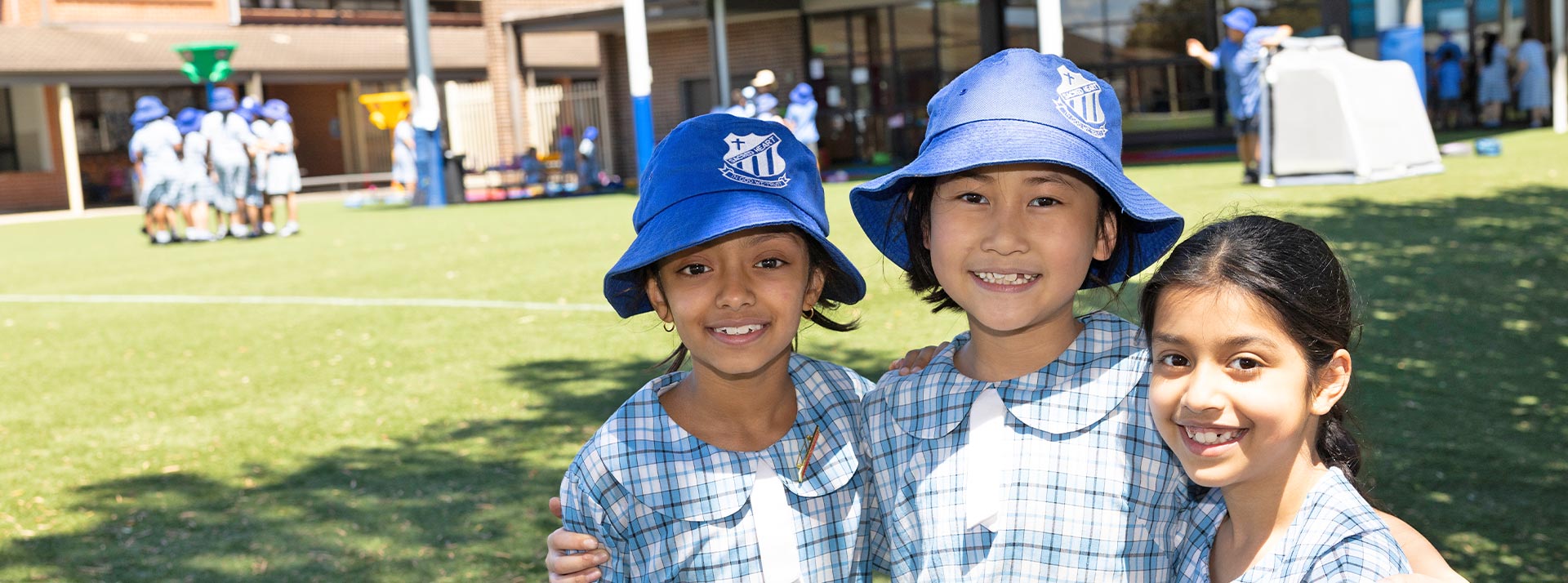 Sacred Heart Mt Druitt students outdoors on school field