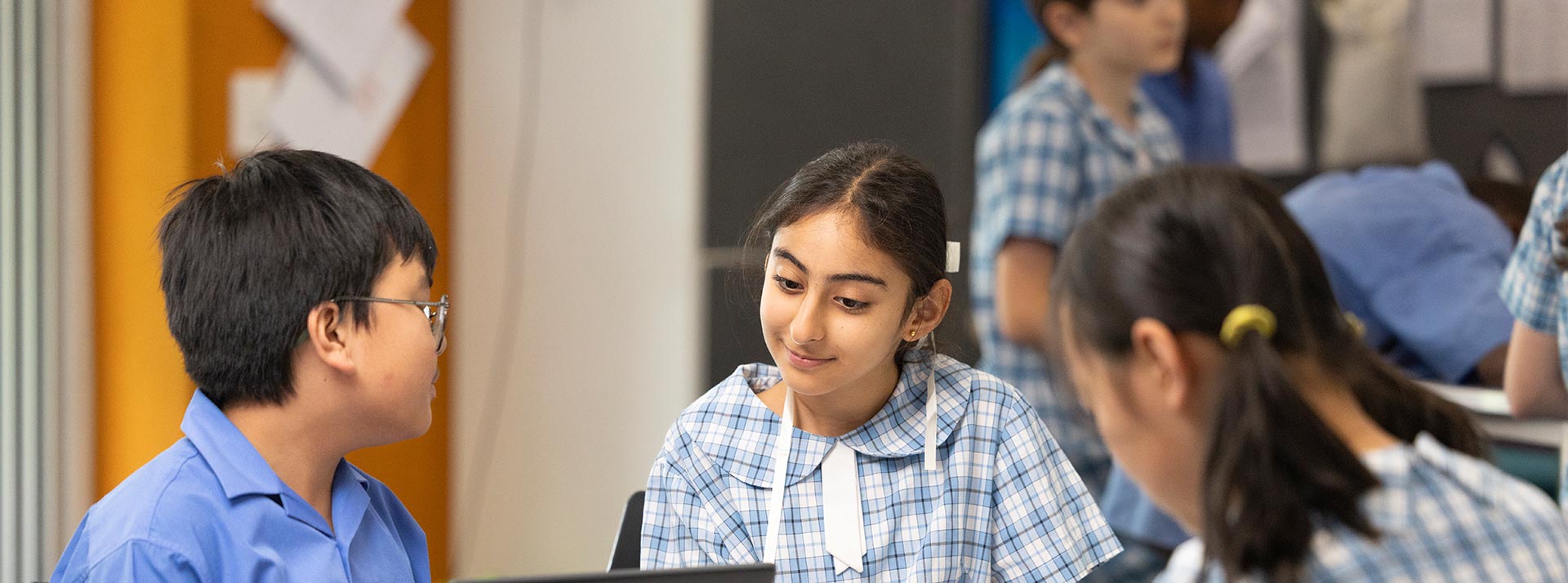 Sacred Heart Mt Druitt students using laptops in class