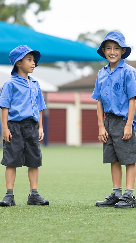 Sacred Heart Mt Druitt students playing on sports field