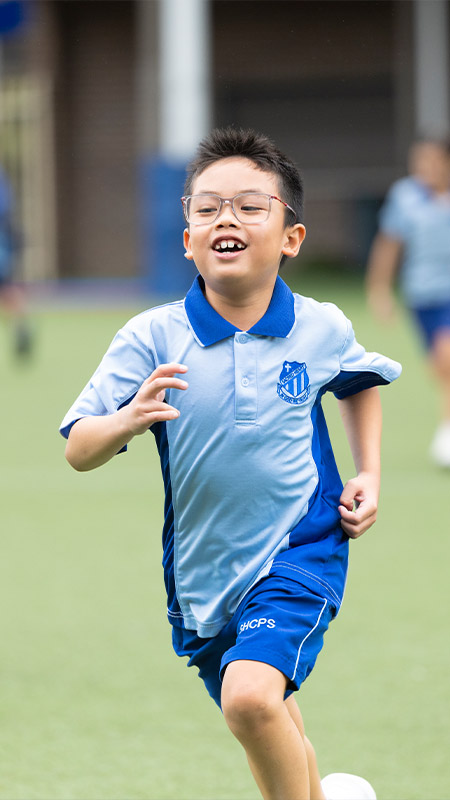 Sacred Heart Primary Mt Druitt students running on outdoor field