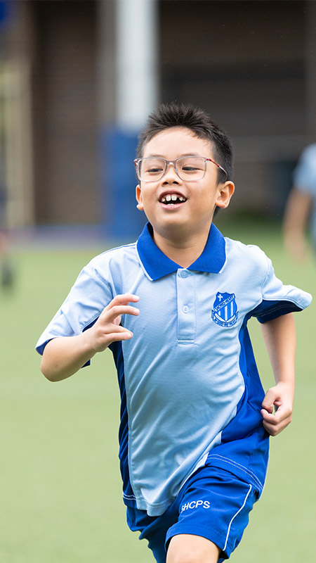 Sacred Heart Mt Druitt students playing on sports field