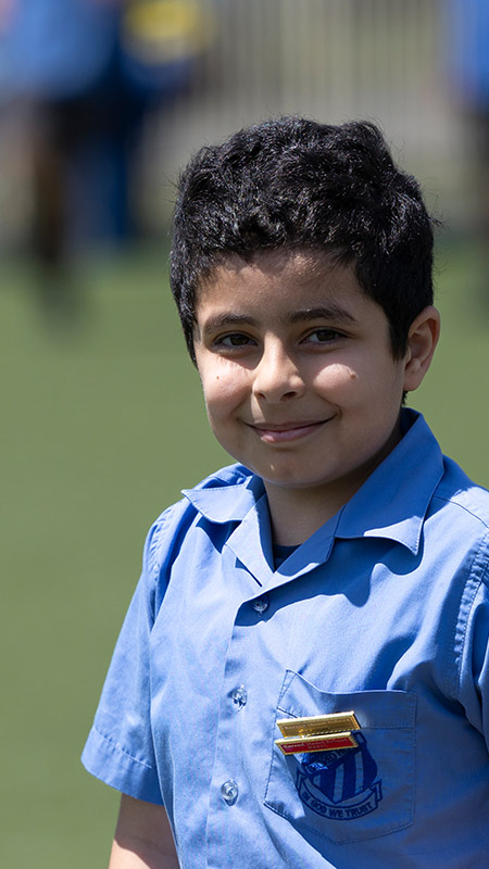Smiling student on outdoor sports field
