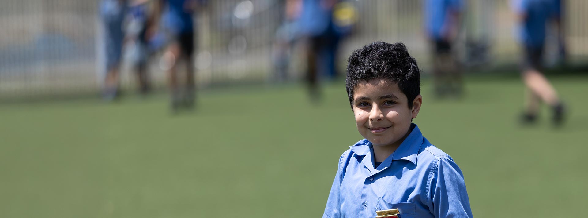 Smiling student on outdoor sports field