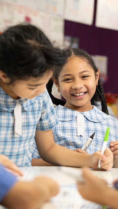 Sacred Heart Mt Druitt students writing in class