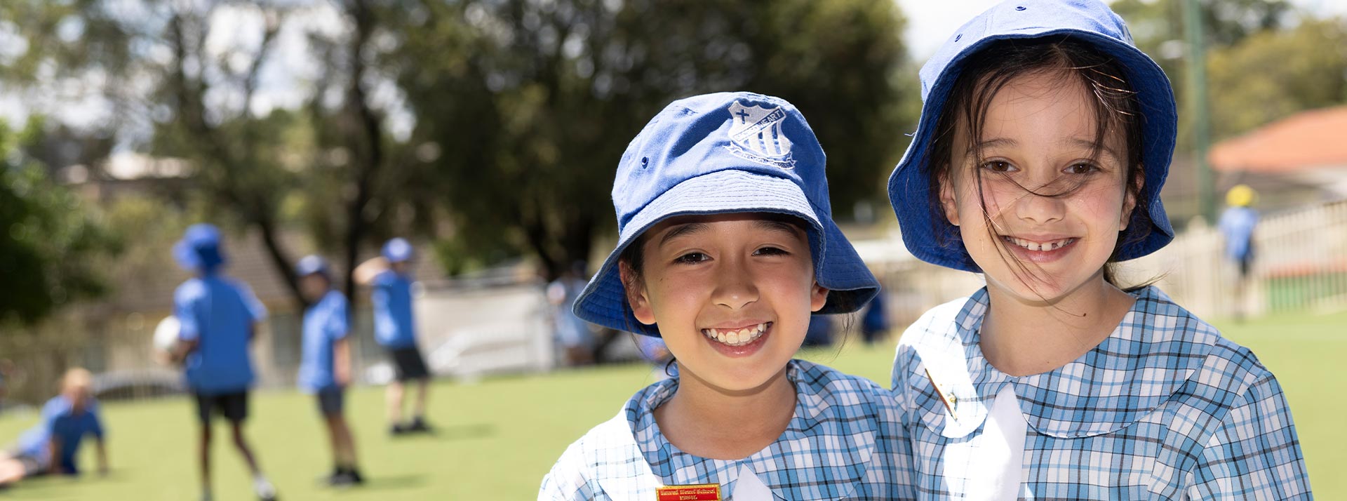 Sacred Heart Mt Druitt students playing on sports field