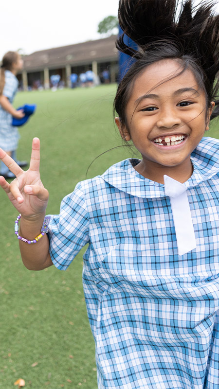 Sacred Heart Mt Druitt students playing on sports field