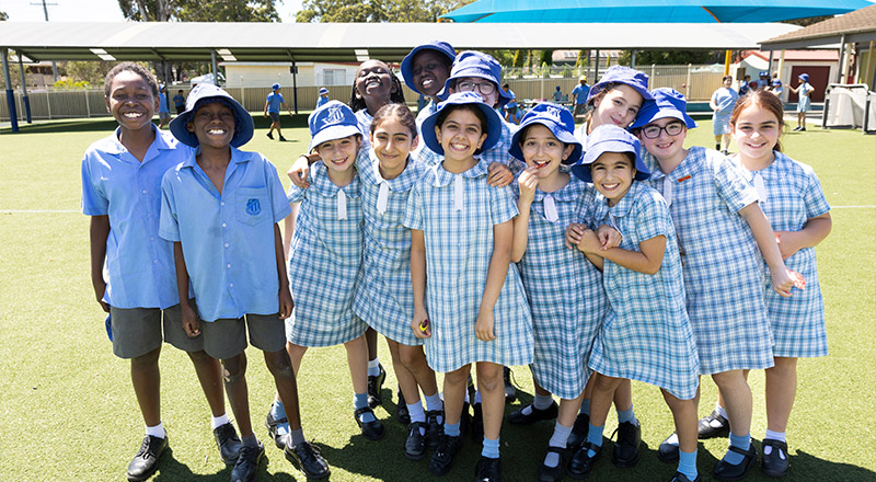 Sacred Heart Mt Druitt students playing on sports field