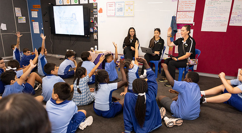 Sacred Heart Mt Druitt Primary student in class, Cathwest representatives speaking to students