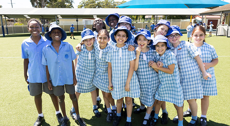 Sacred Heart Mt Druitt students playing on sports field