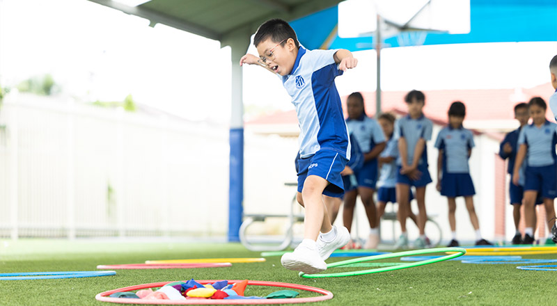 Sacred Heart Mt Druitt students playing outdoors, using play equipment 