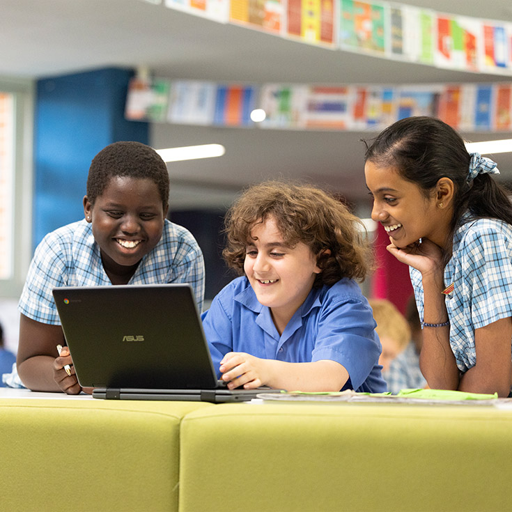 Sacred Heart Mt Druitt students using laptops in class