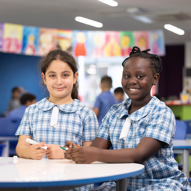 Two Sacred Heart students in class